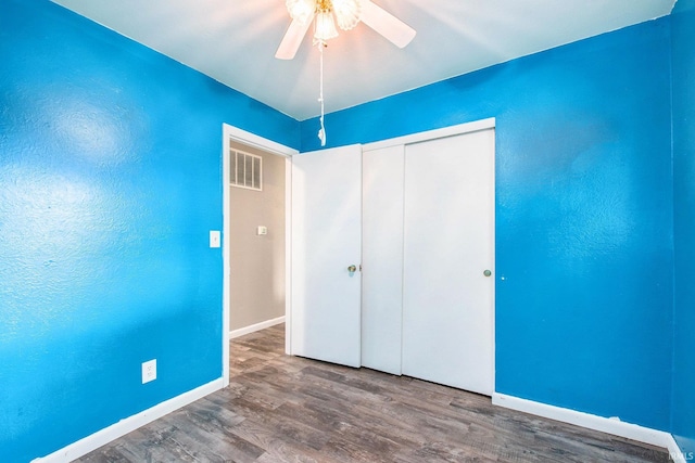 18055 Thomas Ln, Goshen, IN 46528 - unfurnished bedroom featuring wood finished floors, a closet, and a ceiling fan