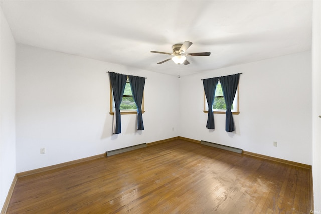 3617 Kirkfield Dr, Fort Wayne, IN 46815 - unfurnished room featuring healthy amount of natural light, ceiling fan, a baseboard radiator, and wood finished floors