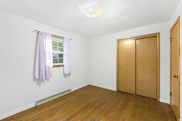 3617 Kirkfield Dr, Fort Wayne, IN 46815 - unfurnished bedroom featuring a baseboard radiator, wood finished floors, and a closet
