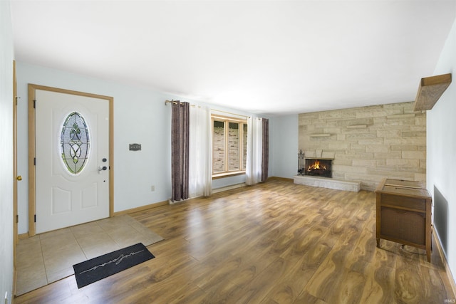 3617 Kirkfield Dr, Fort Wayne, IN 46815 - entryway with wood finished floors and a fireplace