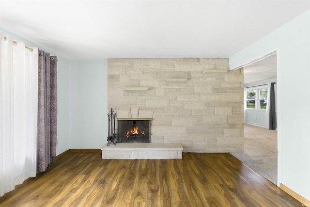 3617 Kirkfield Dr, Fort Wayne, IN 46815 - unfurnished living room with a stone fireplace and wood finished floors