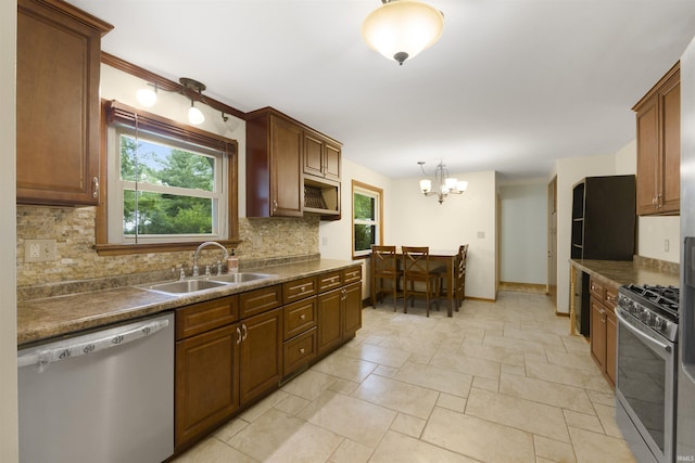 3617 Kirkfield Dr, Fort Wayne, IN 46815 - kitchen featuring stainless steel appliances, healthy amount of natural light, tasteful backsplash, and stone tile floors