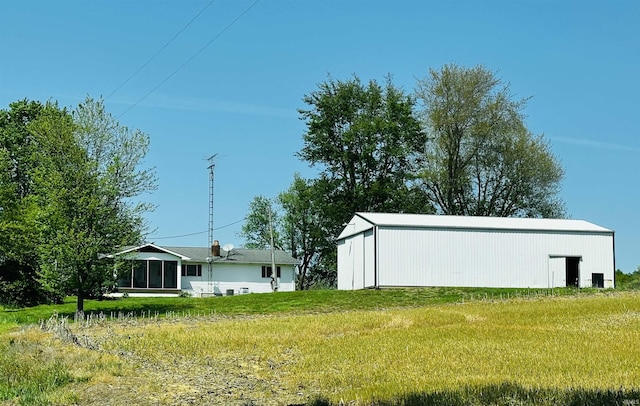 3886 N 1300 E, Loogootee, IN 47553 - view of green lawn with a pole building and an outbuilding