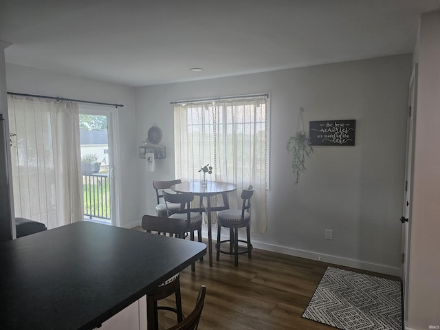 11016 Lakeview Rd, Kewanna, IN 46939 - dining area with dark wood-style flooring and baseboards