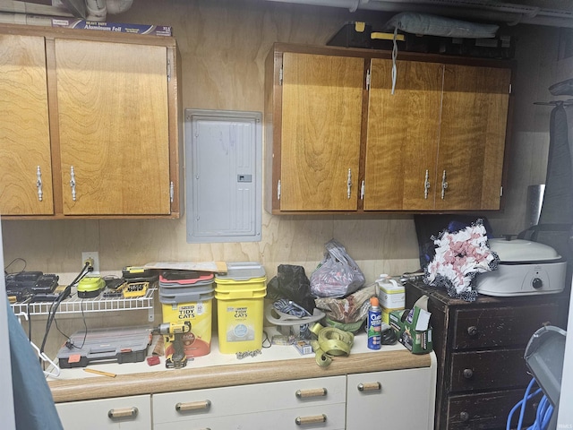 11016 Lakeview Rd, Kewanna, IN 46939 - kitchen with electric panel, light countertops, and brown cabinetry