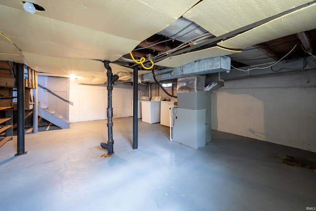 1201 Canal St, New Haven, IN 46774 - unfinished below grade area featuring stairway, washing machine and dryer, and heating unit