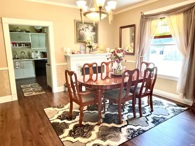 946 S 23rd St, South Bend, IN 46615 - dining space with a chandelier, ornamental molding, and dark wood-style flooring