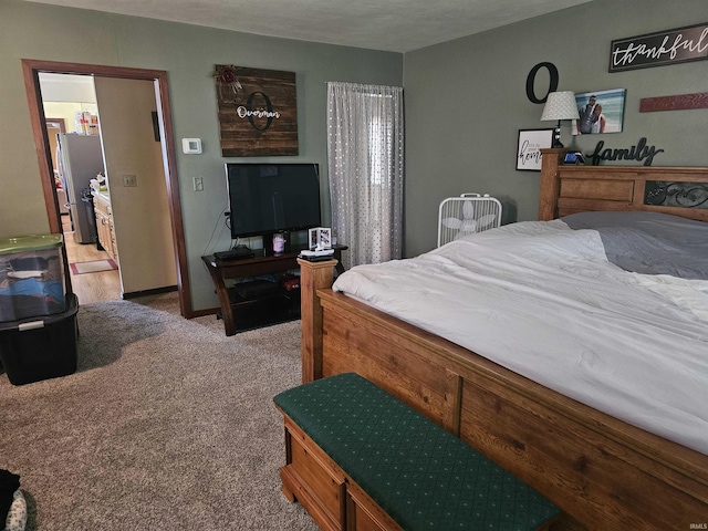 922 21st St, Logansport, IN 46947 - bedroom featuring light colored carpet and freestanding refrigerator