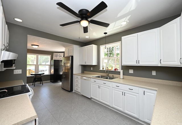 418 W 7th St, Rochester, IN 46975 - kitchen with white appliances, plenty of natural light, ceiling fan, white cabinets, and recessed lighting