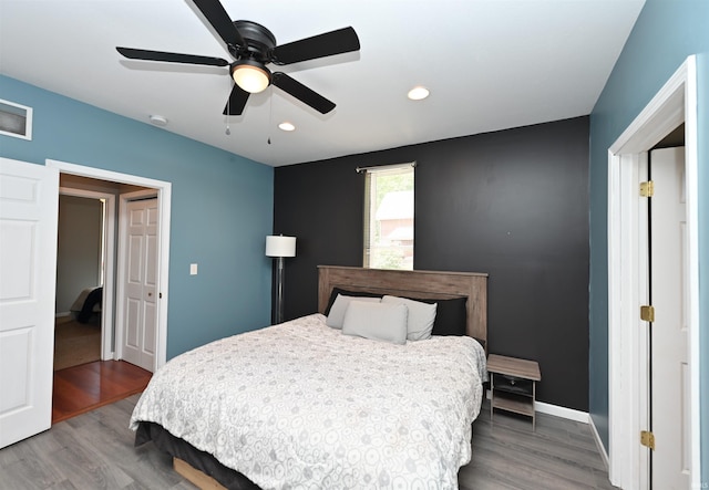 418 W 7th St, Rochester, IN 46975 - bedroom with wood finished floors, recessed lighting, and a ceiling fan