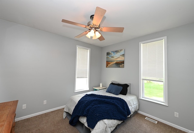 418 W 7th St, Rochester, IN 46975 - carpeted bedroom featuring baseboards and a ceiling fan