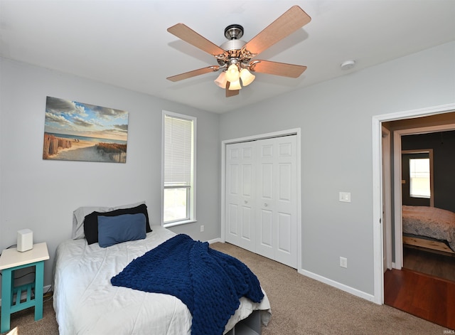 418 W 7th St, Rochester, IN 46975 - carpeted bedroom with a closet and a ceiling fan