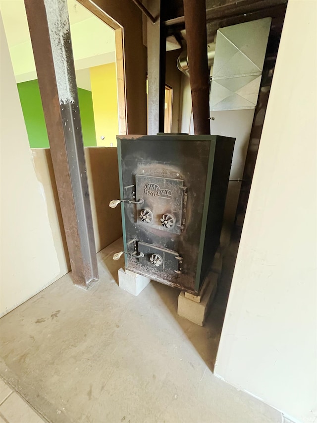 4524 E 800 N, Ossian, IN 46777 - detailed view of unfinished concrete flooring and a wood stove