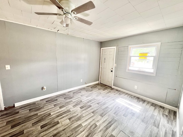 251 E 5th St, Peru, IN 46970 - unfurnished room with wood finished floors and a ceiling fan