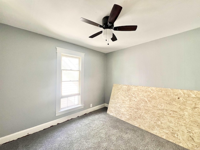 251 E 5th St, Peru, IN 46970 - carpeted spare room featuring a ceiling fan and baseboards