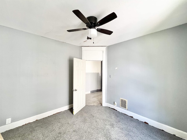 251 E 5th St, Peru, IN 46970 - unfurnished bedroom with carpet floors and ceiling fan
