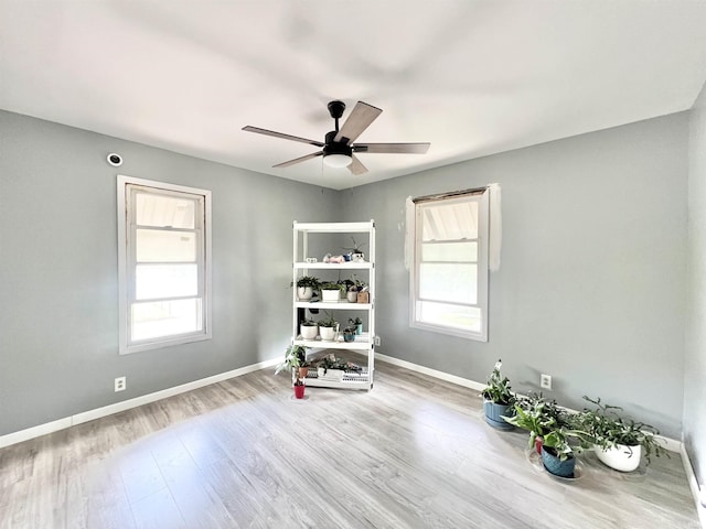 251 E 5th St, Peru, IN 46970 - miscellaneous room featuring wood finished floors and a ceiling fan