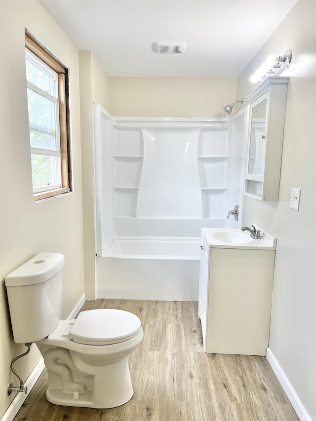 251 E 5th St, Peru, IN 46970 - bathroom featuring wood finished floors, vanity, and shower / washtub combination