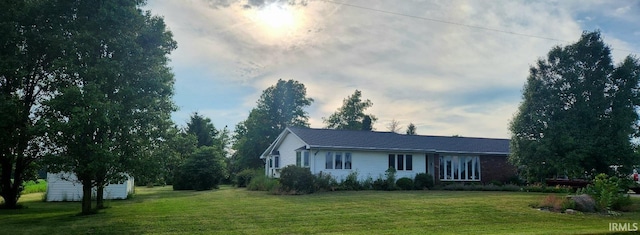 8276 N 100th Rd, Uniondale, IN 46791 - ranch-style home featuring a front yard and an outbuilding