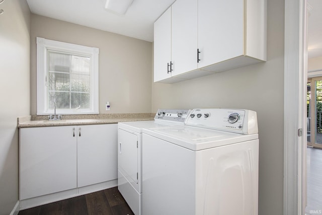 57329 Orchard Ridge Dr, Elkhart, IN 46516 - washroom featuring independent washer and dryer, cabinet space, and dark wood finished floors