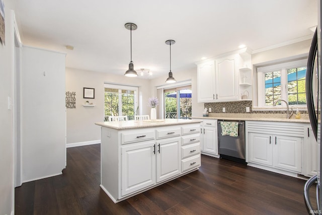 57329 Orchard Ridge Dr, Elkhart, IN 46516 - kitchen with dishwasher, dark wood finished floors, light countertops, a center island, and white cabinets
