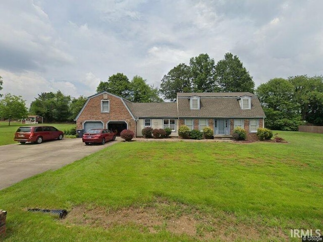 2390 Viehe Dr, Evansville, IN 47725 - dutch colonial with concrete driveway, a front yard, and a gambrel roof