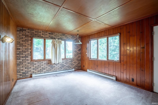 2200 S 460 E, Lagrange, IN 46761 - empty room featuring a baseboard radiator, wood walls, and carpet flooring