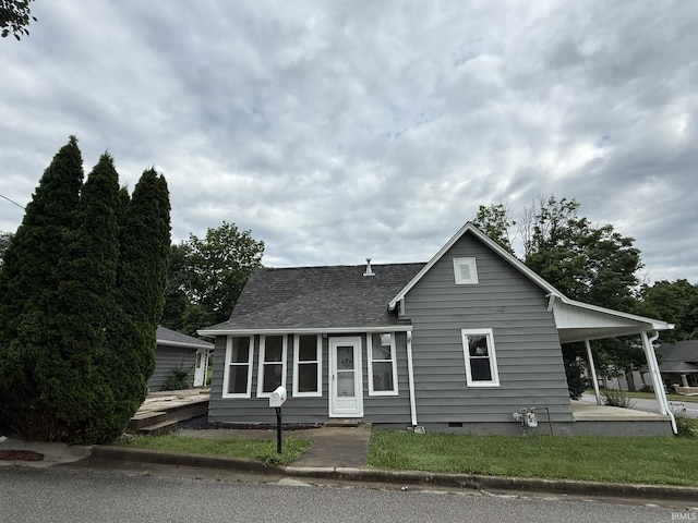 903 W Temperance St, Ellettsville, IN 47429 - view of front facade featuring a shingled roof and crawl space