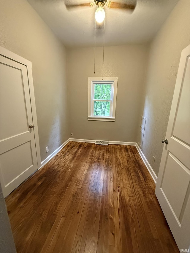 903 W Temperance St, Ellettsville, IN 47429 - unfurnished room featuring dark wood-style floors and ceiling fan