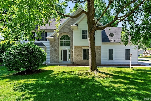 14276 Old Pine Ln, Mishawaka, IN 46545 - view of front of house featuring a front yard, brick siding, and roof with shingles