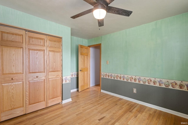 26247 Douglas Ave, Elkhart, IN 46514 - unfurnished bedroom with light wood finished floors, a closet, and a ceiling fan