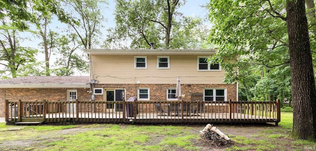 26247 Douglas Ave, Elkhart, IN 46514 - back of house featuring brick siding, a deck, and a lawn