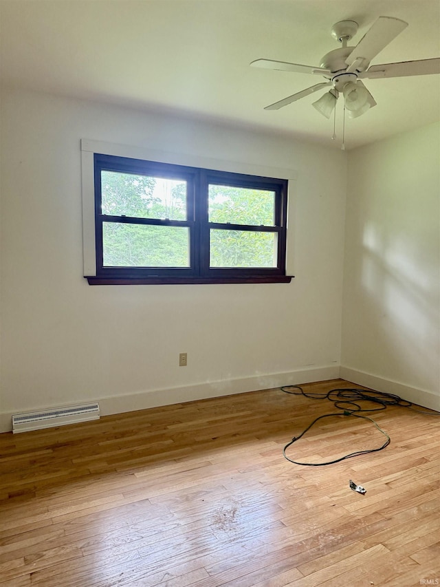 1417 E Clairmont Pl, Bloomington, IN 47401 - empty room featuring plenty of natural light, hardwood / wood-style floors, and ceiling fan