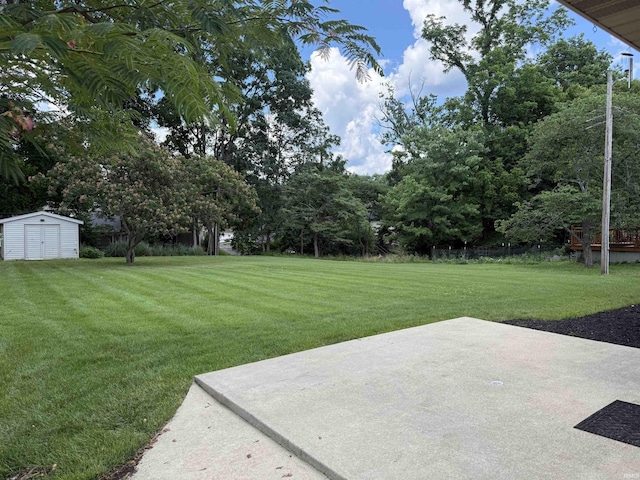 1417 E Clairmont Pl, Bloomington, IN 47401 - view of green lawn with a patio area and a storage shed
