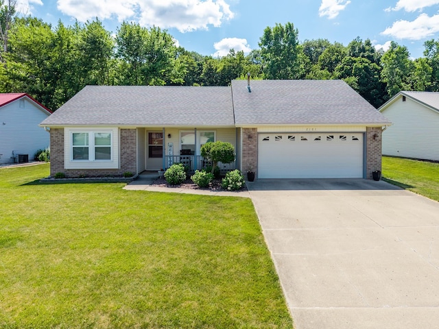2101 Portage Pass, Auburn, IN 46706 - single story home with brick siding, an attached garage, and a porch
