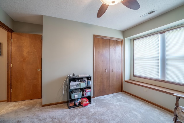 2101 Portage Pass, Auburn, IN 46706 - bedroom featuring carpet, a closet, a textured ceiling, and ceiling fan