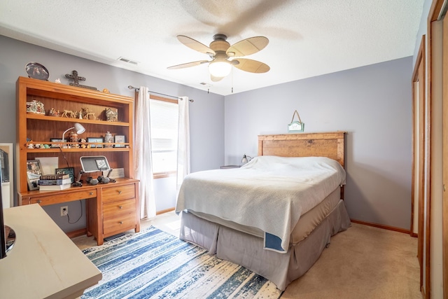 2101 Portage Pass, Auburn, IN 46706 - bedroom with ceiling fan, light carpet, and a textured ceiling