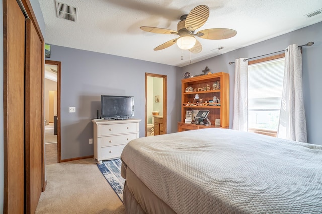 2101 Portage Pass, Auburn, IN 46706 - bedroom with light carpet, ensuite bath, and ceiling fan