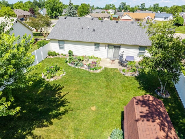 2101 Portage Pass, Auburn, IN 46706 - back of house with a patio, a fenced backyard, a shingled roof, and a residential view