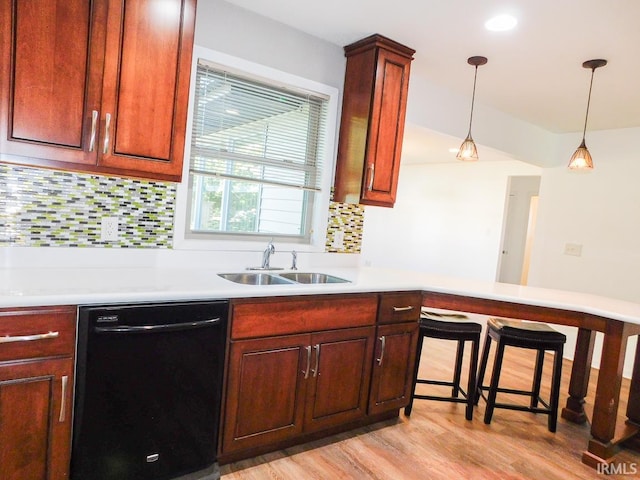185 W Mercury St, Markle, IN 46770 - kitchen with dishwasher, tasteful backsplash, light wood-type flooring, and light countertops
