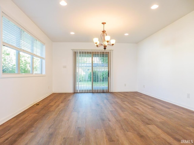 185 W Mercury St, Markle, IN 46770 - unfurnished room with plenty of natural light, a chandelier, wood finished floors, and recessed lighting
