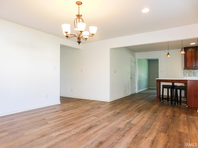 185 W Mercury St, Markle, IN 46770 - empty room featuring a chandelier, wood finished floors, and recessed lighting