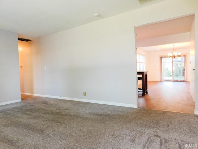 185 W Mercury St, Markle, IN 46770 - carpeted empty room featuring a chandelier and baseboards