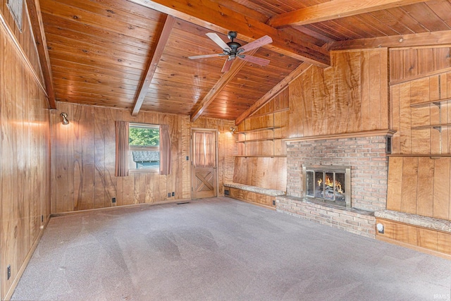 3303 Hilltop Dr, South Bend, IN 46614 - unfurnished living room featuring wood walls, wood ceiling, a fireplace, ceiling fan, and carpet flooring