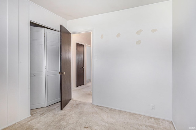 3303 Hilltop Dr, South Bend, IN 46614 - unfurnished bedroom with light colored carpet and a closet