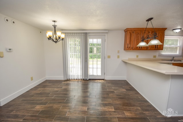 4044 S Younkin Dr, Redkey, IN 47373 - unfurnished dining area with dark wood-type flooring, a chandelier, and a textured ceiling