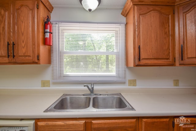 4044 S Younkin Dr, Redkey, IN 47373 - kitchen featuring light countertops and brown cabinetry