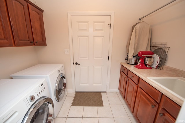 344 Rosebank Ln, West Lafayette, IN 47906 - washroom with washing machine and dryer, cabinet space, and light tile patterned floors