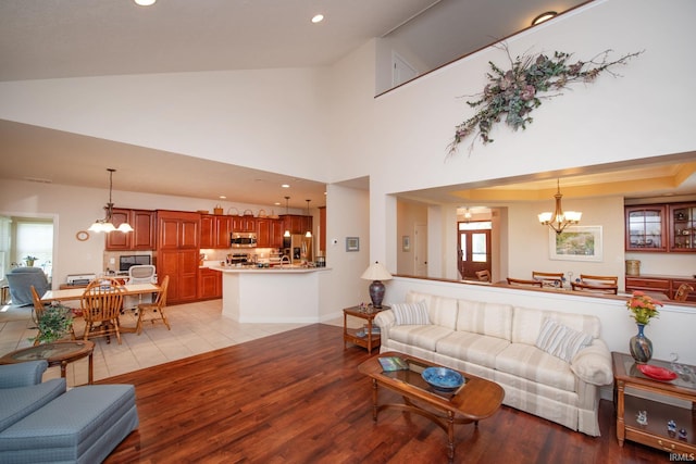 344 Rosebank Ln, West Lafayette, IN 47906 - living area with a chandelier, light wood finished floors, recessed lighting, and high vaulted ceiling