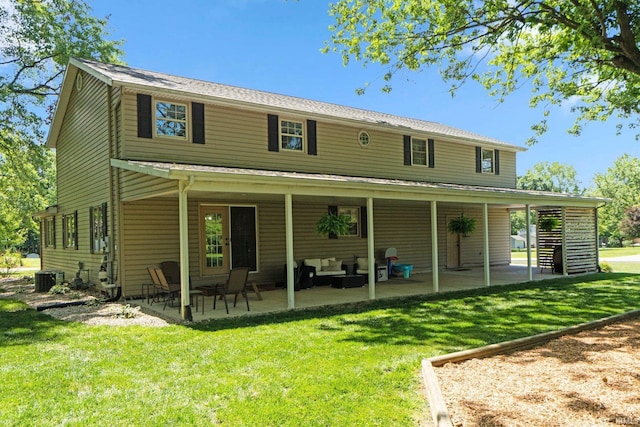 1704 S Sutton Circle Dr, Bluffton, IN 46714 - rear view of property with a patio area and a lawn